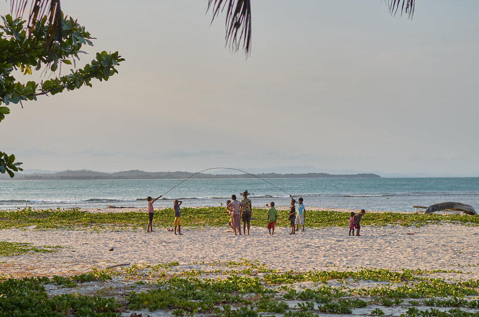 Local people playing in Mahambo's beach
